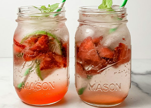berry drink with real fruit in a glass with a straw