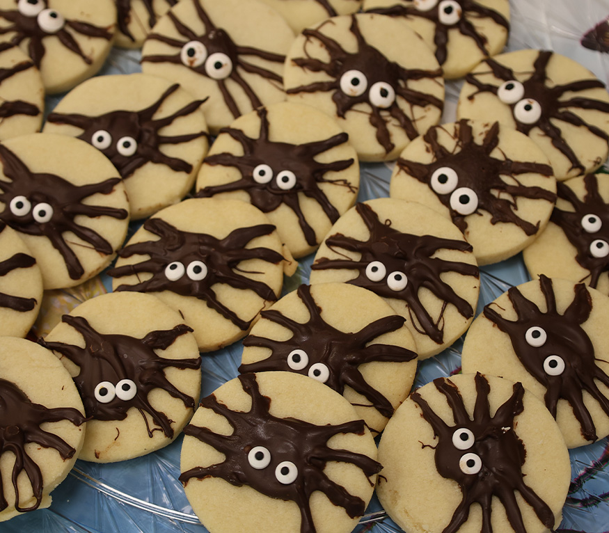 spider decorated sugar cookies on a plate