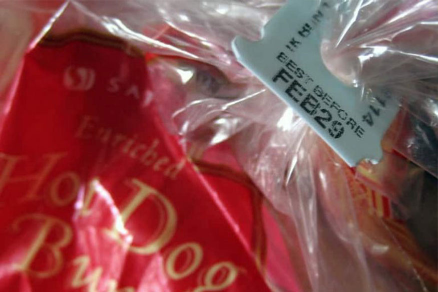 red bag of hot dog buns with a best before Feb 29 date on them